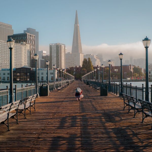 A person is strolling along a pier in San Francisco.