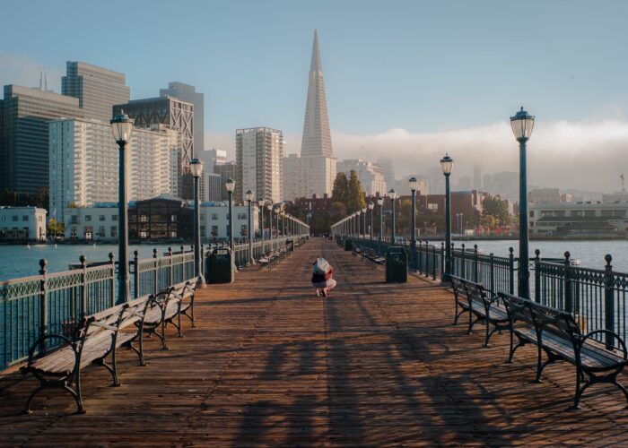 A person is strolling along a pier in San Francisco.