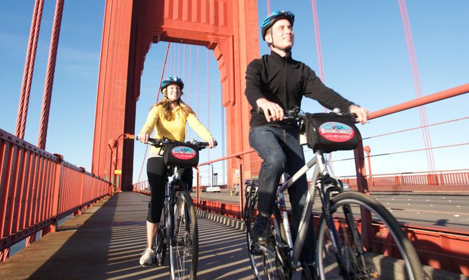A man and woman bike in San Francisco