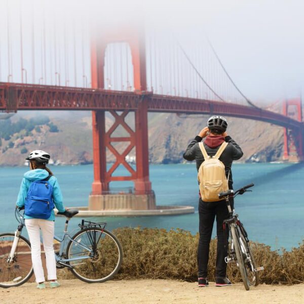 Photo of two people looking at the golden fate bridge on a San Francisco tour.