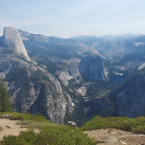A breathtaking view of Yosemite National Park from the top of a mountain.