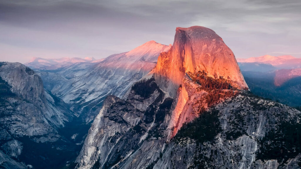 Half dome at Yosemite National Park, a breathtaking view that even non-hikers can appreciate, bathed in the warm glow of sunset.