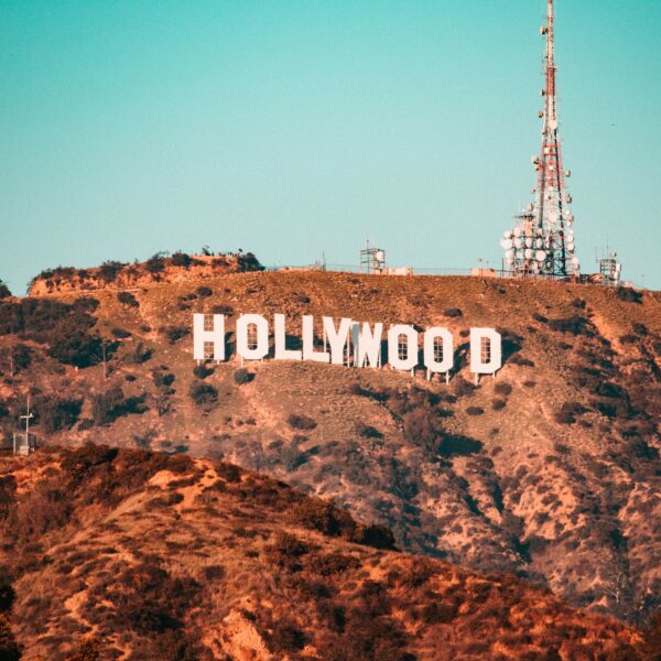 The Hollywood sign is displayed on a hillside with antenna towers in the background—an iconic sight for anyone journeying from Los Angeles to San Francisco, capturing California's allure.