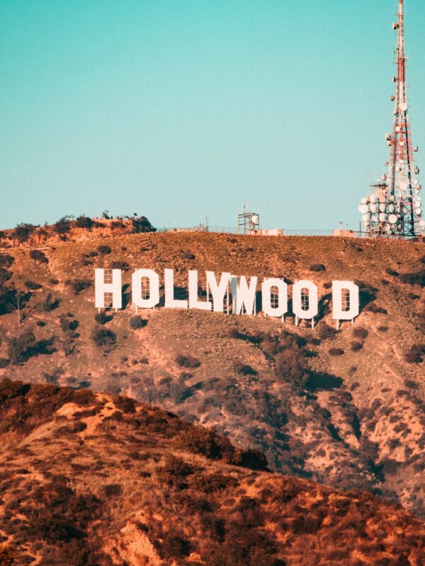 The Hollywood sign is displayed on a hillside with antenna towers in the background—an iconic sight for anyone journeying from Los Angeles to San Francisco, capturing California's allure.